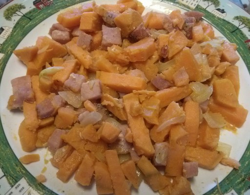 plate of sweet potatoes with onions and Canadian Bacon