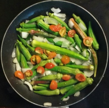 Vegetables in the stir-fry were cherry tomatoes, onions, and whole okra.